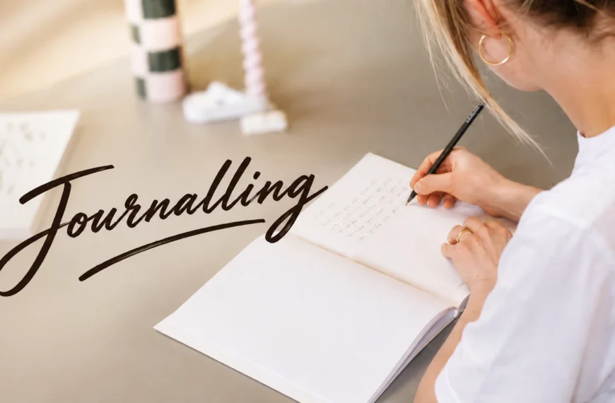 Journaling | Young Sri Lankan woman writing in a journal by a window with a cup of tea, practising journaling to reduce stress, organise her thoughts, and improve mental wellbeing.