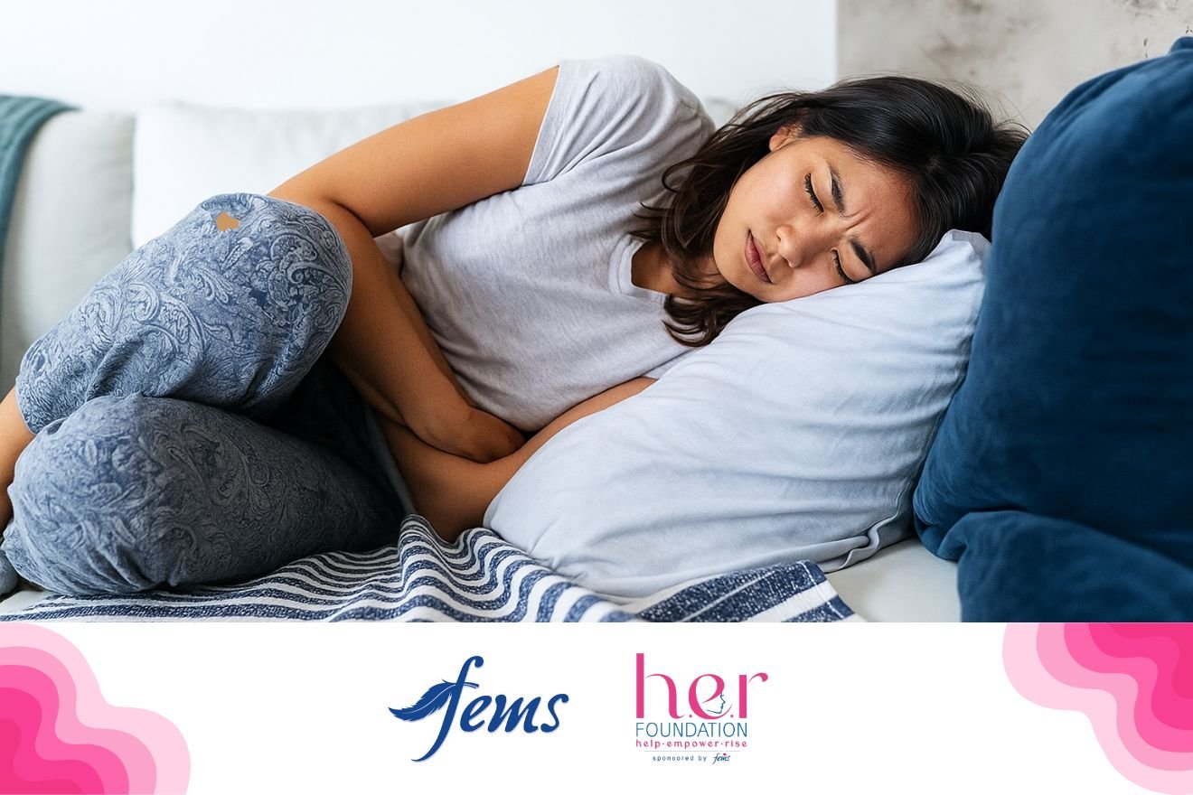 ඔසප් වීම | Woman lying on a bed holding her lower abdomen in pain, with Fems and HER Foundation logos displayed at the bottom.